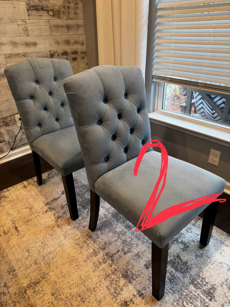 Light blue velour side chairs, tufted back, black base